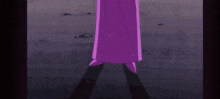 a purple slide is going down a concrete surface