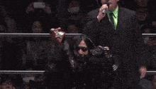 a young lions shirt is on a man in a ring