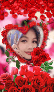 a woman is surrounded by red roses and petals in a heart shaped frame