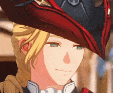 a close up of a person 's face wearing a red hat