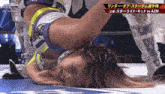 a woman is laying on her back in a wrestling ring with the words stardom on the bottom