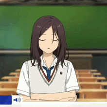 a girl is sitting in a classroom with her eyes closed and her arms crossed .