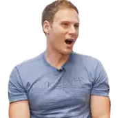 a man wearing a blue quiksilver shirt is sitting with his mouth open .