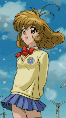 a girl in a yellow sweater and blue skirt has a circle on her chest