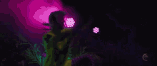 a man in a yellow shirt is dancing in a dark room with purple lights .