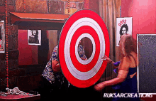 a woman throws a dart at a target that says ruksarcreations on the bottom