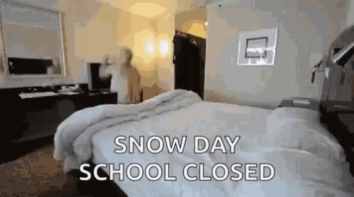 GIF of teacher jumping back into bed because it's a snow day