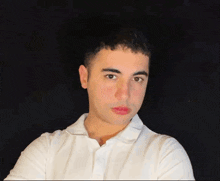 a young man wearing a white shirt and red lipstick on his lips