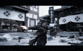 a man holding a sword stands in front of a building with chinese writing on it