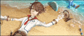 a boy is laying on the beach with a fan .