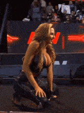 a woman with a very large breast is kneeling down in front of a sign that says ew