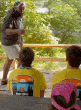 a group of people wearing yellow shirts with mount victory written on them