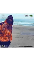 a video of a man standing on a beach with the words rec and hdv on the bottom
