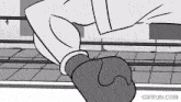 a black and white cartoon of a man wearing boxing gloves .