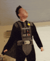 a man in a darth vader costume is looking up