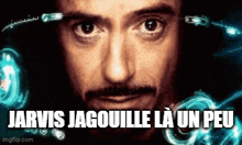 a close up of a man 's face with the words jarvis jagouille la un peu below him