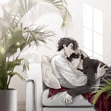 a couple laying on a couch with a plant behind them