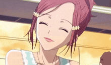 a girl with flowers in her hair is smiling