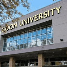 a building with a sign that says ' gon university ' on it