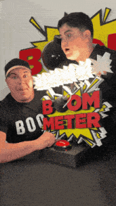 two men standing next to a boom meter