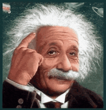 albert einstein is wearing a suit and tie and pointing his finger at his forehead