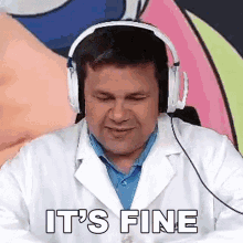 a man wearing headphones and a lab coat is sitting in front of a colorful background .