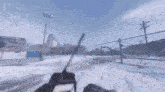 a person holding a walkie talkie in a snowy area