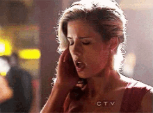a woman is talking on a phone with ctv written on the bottom