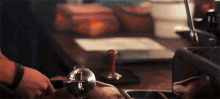 a person is using a coffee press to make coffee