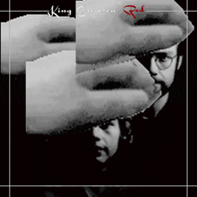 an album cover for king crimson red shows a man with glasses