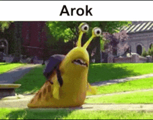 a cartoon snail is walking down a sidewalk in a park with a backpack .