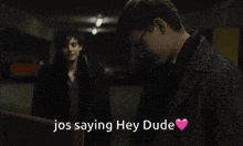 a man with glasses is standing next to another man with the words jos saying hey dude above him