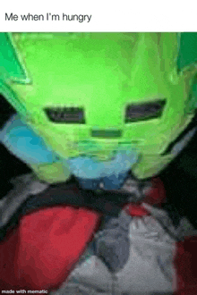 a person wearing a green mask and a red shirt is eating something .