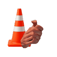 a hand is clapping in front of an orange cone