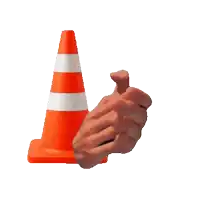 a hand is clapping in front of an orange cone