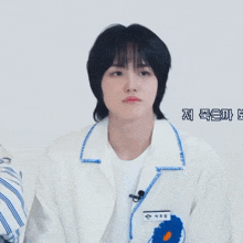 a person wearing a white jacket has a name tag that says ' eee ' on it