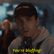 a man in a hat says you 're bluffing