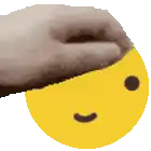 a hand is holding a smiley face with a smile on it .