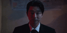 a man is pointing a gun at his head