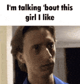 a man in a blue shirt is talking about the girl he likes