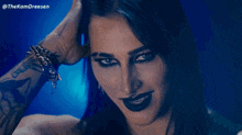 a close up of a woman 's face with the hashtag thekamdreesen on the bottom