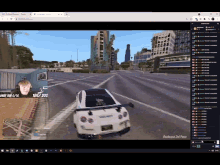 a computer screen shows a car driving down a street with a man behind it and a few other people watching