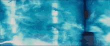 a blue background with a blurred image of a building
