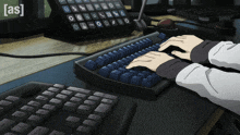 a person is typing on a keyboard with a phone in the background that says [ as ] on it