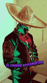 a man in a mariachi outfit is wearing a sombrero and holding a gun .