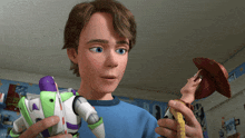 a boy is holding buzz lightyear and woody dolls