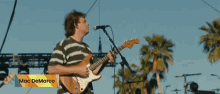 jumping playing guitar excited concert mac demarco