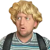 a man wearing a blonde wig and a striped shirt