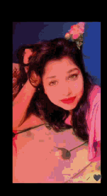 a pixelated image of a woman with a flower on her head