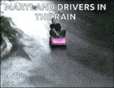 a man is driving a go kart in the rain .